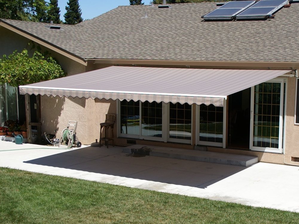 Retractable awning extended over a home patio